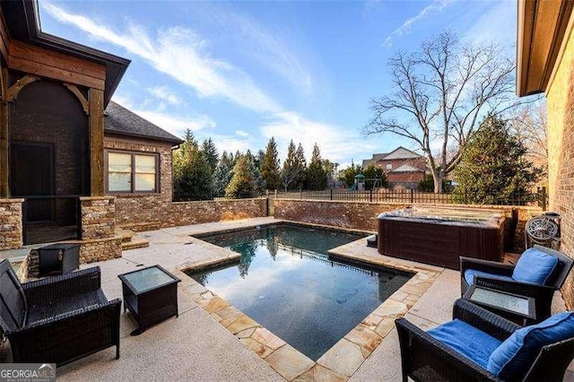 view of swimming pool with a patio, a fenced backyard, and a hot tub