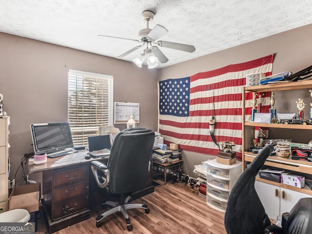 office space with hardwood / wood-style flooring, ceiling fan, and a textured ceiling