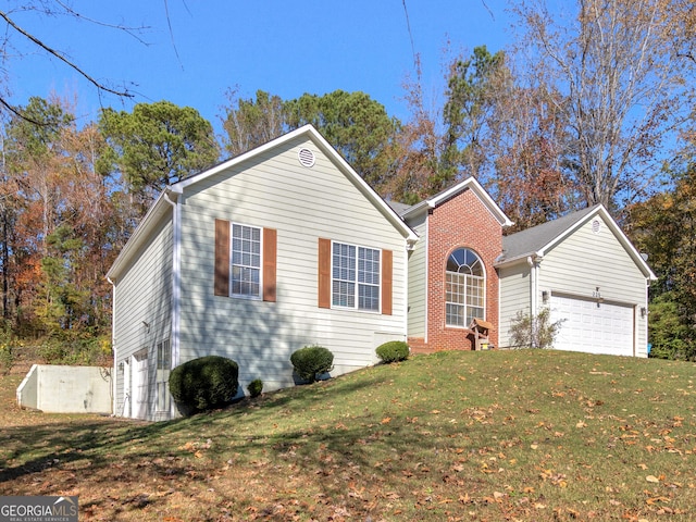 view of property featuring a garage and a front yard