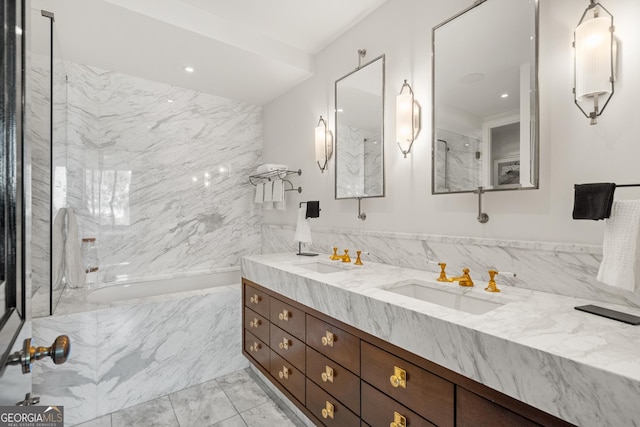 bathroom featuring vanity and tile walls