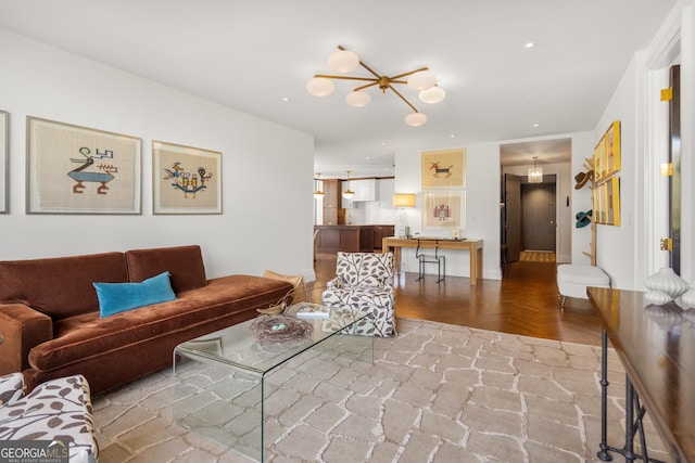 living room featuring parquet flooring and a chandelier