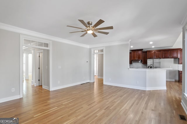 unfurnished living room with ornamental molding, light hardwood / wood-style floors, and ceiling fan