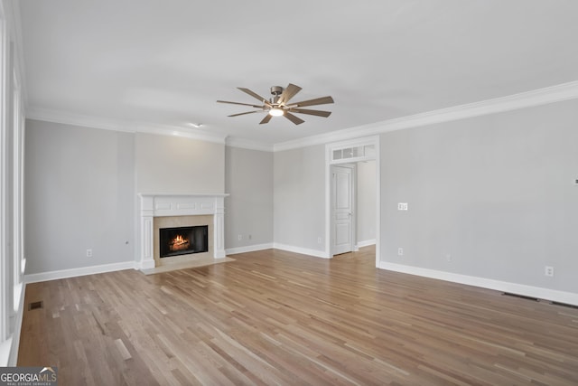 4974 Dovecote Trl, Suwanee, GA 30024 - unfurnished living room with ceiling fan, crown molding, light wood finished floors, and a fireplace