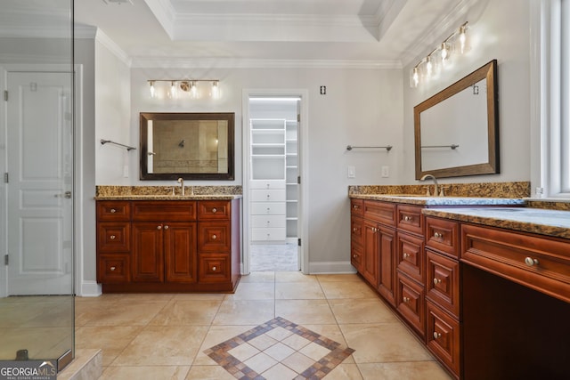 bathroom featuring vanity, crown molding, a raised ceiling, and walk in shower