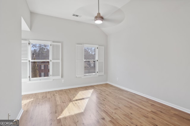 unfurnished room featuring ceiling fan, vaulted ceiling, and light hardwood / wood-style flooring