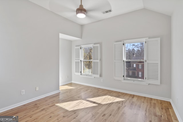 unfurnished room featuring lofted ceiling, light hardwood / wood-style flooring, and ceiling fan