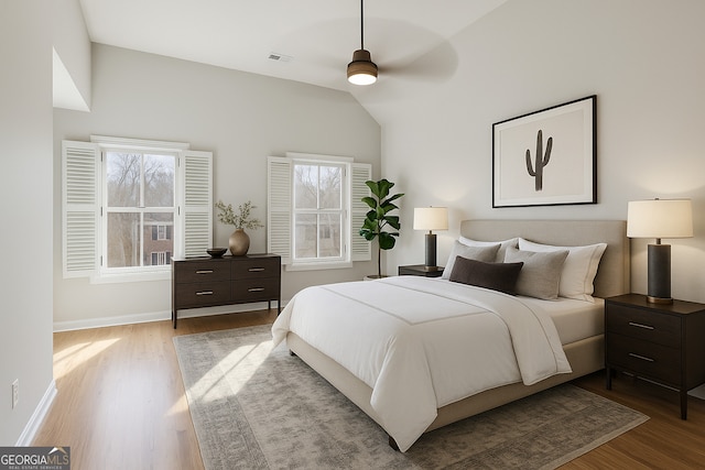 4974 Dovecote Trl, Suwanee, GA 30024 - bedroom with wood finished floors and lofted ceiling