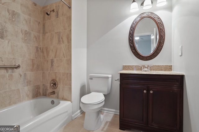 full bathroom featuring tiled shower / bath combo, vanity, tile patterned floors, and toilet