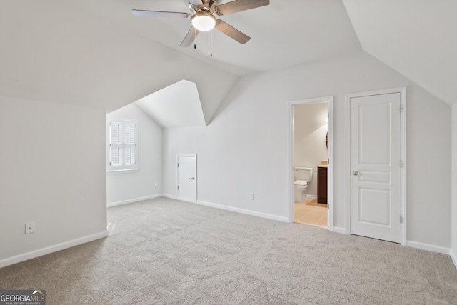 4974 Dovecote Trl, Suwanee, GA 30024 - additional living space featuring vaulted ceiling, carpet floors, and a ceiling fan