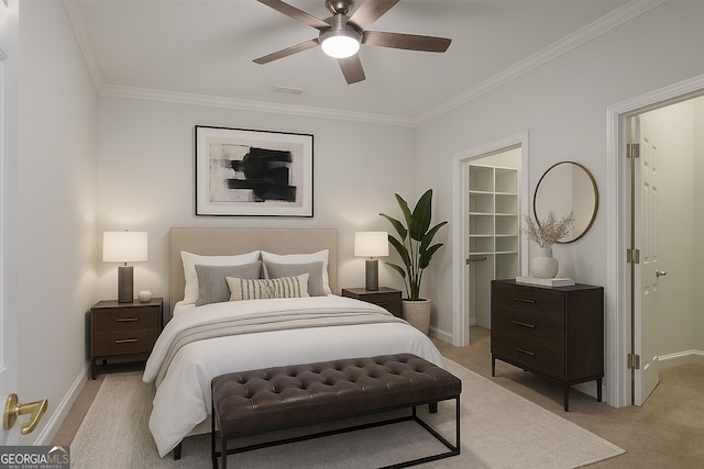 4974 Dovecote Trl, Suwanee, GA 30024 - bedroom with light colored carpet, a walk in closet, ornamental molding, a closet, and a ceiling fan