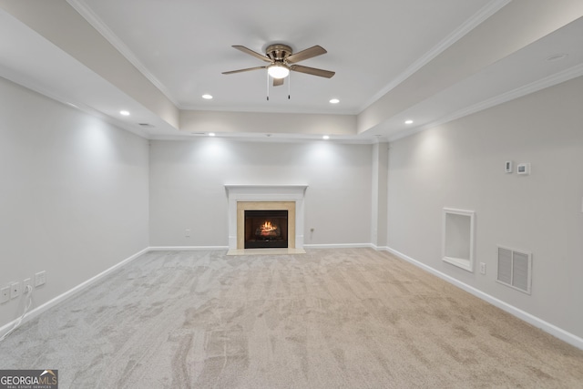 4974 Dovecote Trl, Suwanee, GA 30024 - unfurnished living room with a ceiling fan, crown molding, carpet, a lit fireplace, and a tray ceiling