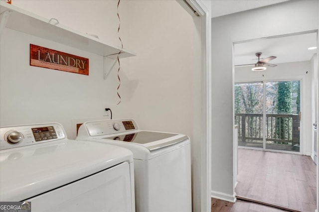 clothes washing area featuring ceiling fan, washer and dryer, and light hardwood / wood-style floors