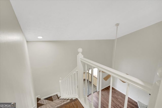 staircase featuring hardwood / wood-style flooring