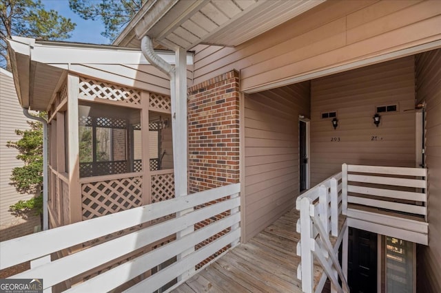 view of home's exterior with a sunroom