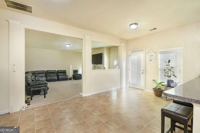 view of carpeted entrance foyer