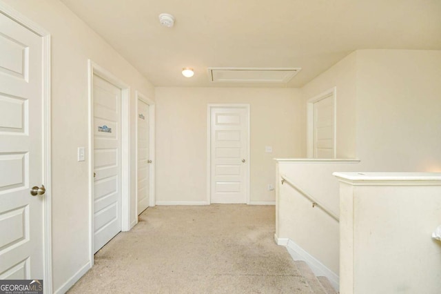 hallway featuring light carpet