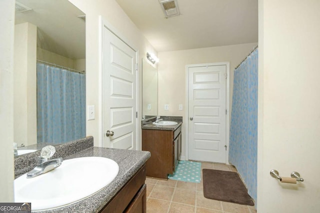 bathroom with vanity and tile patterned flooring