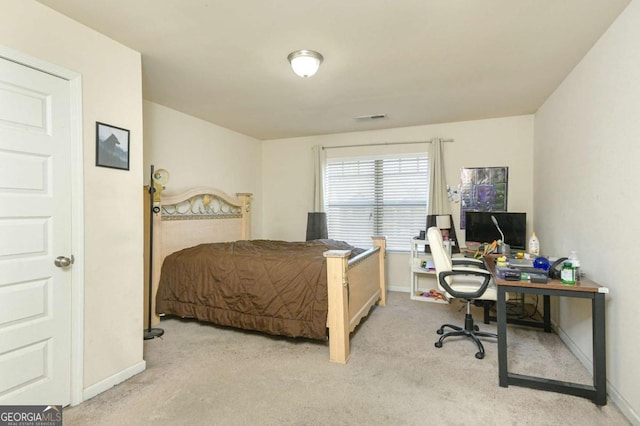 bedroom with light carpet