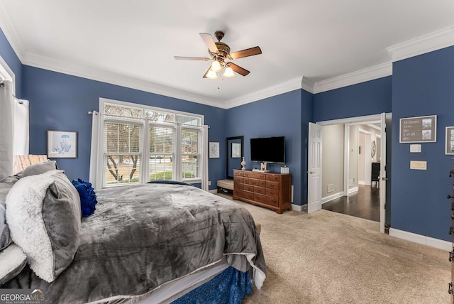 carpeted bedroom with crown molding and ceiling fan