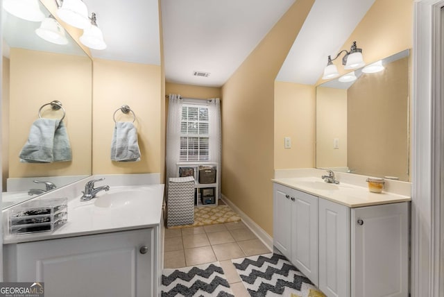 bathroom featuring tile patterned flooring and vanity