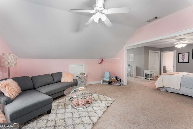 living room featuring ceiling fan, light colored carpet, and lofted ceiling