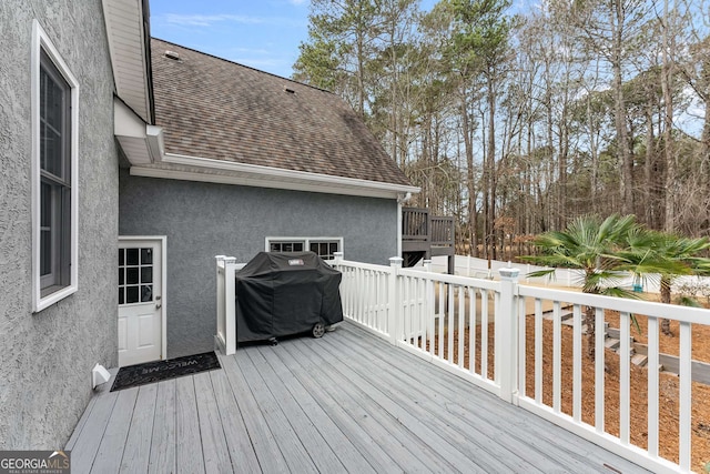 wooden deck with grilling area