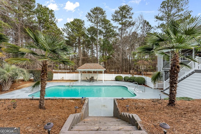 view of swimming pool with a gazebo and a patio