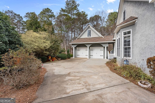 view of side of property with a garage