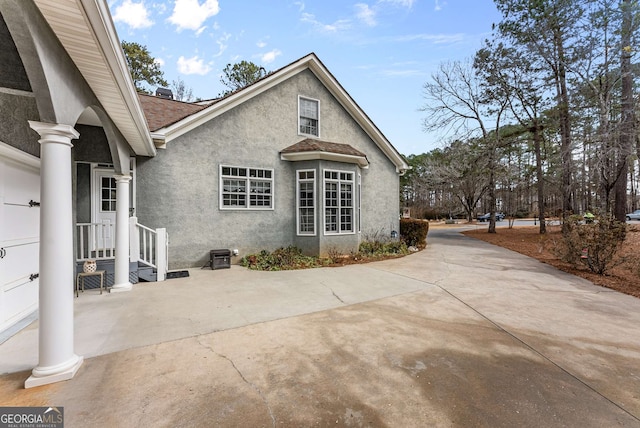 view of side of property featuring a patio