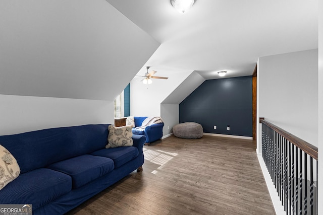 living room with vaulted ceiling, dark hardwood / wood-style floors, and ceiling fan