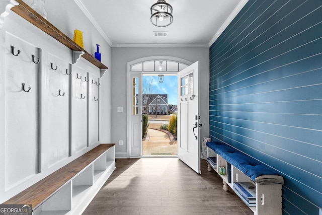 mudroom with crown molding and dark hardwood / wood-style floors