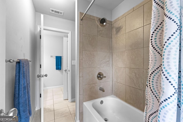 bathroom featuring shower / bath combination with curtain and tile patterned flooring