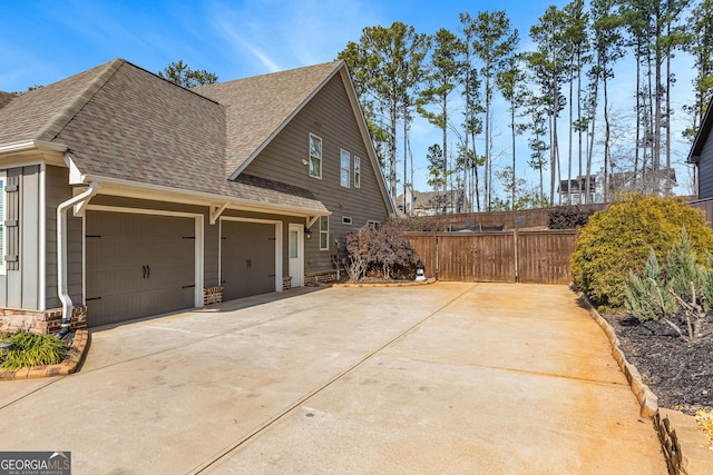 view of side of property featuring a garage