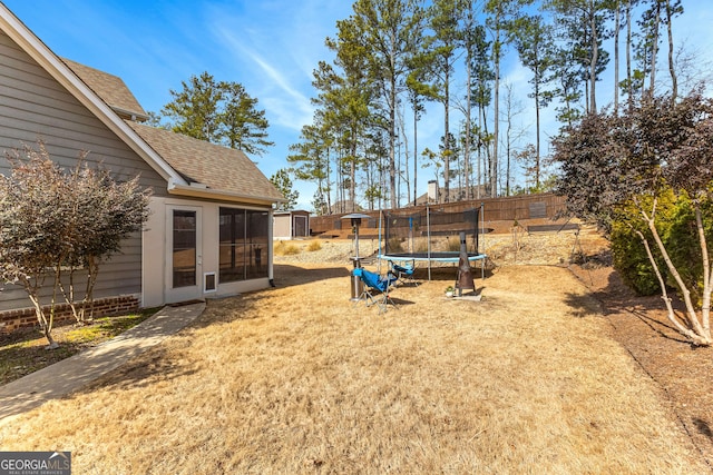 view of yard featuring a trampoline