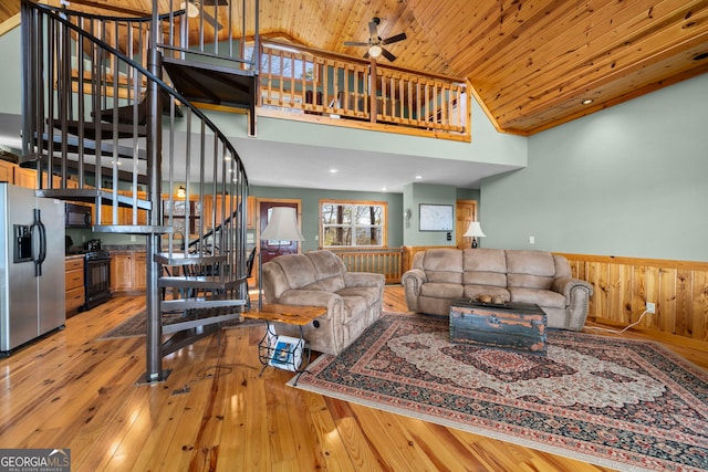 living room featuring ceiling fan, high vaulted ceiling, wood ceiling, and light hardwood / wood-style floors