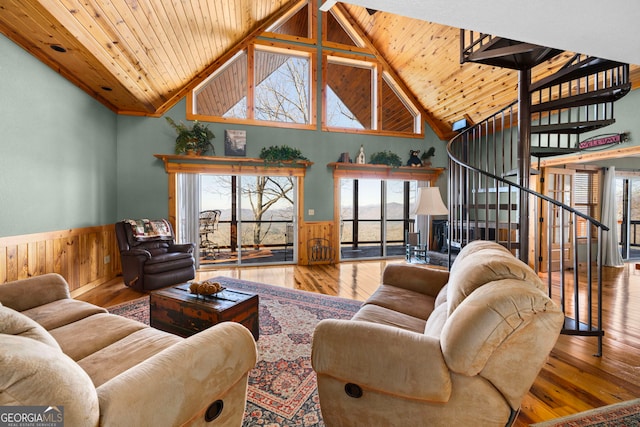 living room with high vaulted ceiling, wood-type flooring, and wooden ceiling