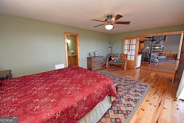 bedroom featuring french doors and wood-type flooring