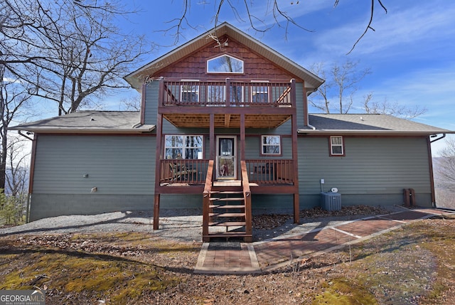 back of property featuring central AC