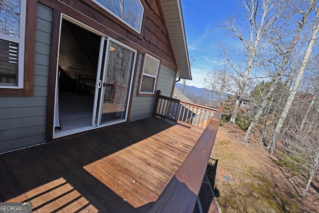 wooden deck featuring a mountain view