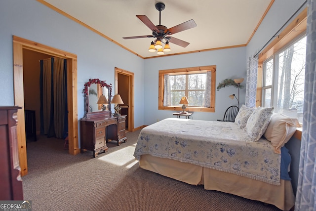 carpeted bedroom featuring ornamental molding and ceiling fan