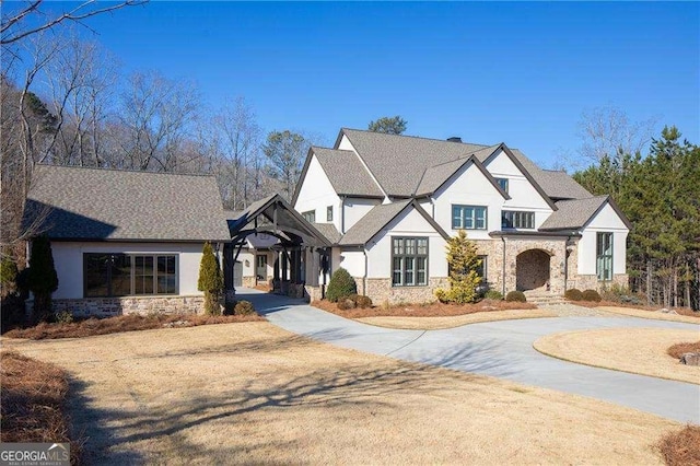 5152 Boulder Bluff Way, Suwanee, GA 30024 - view of front facade with stone siding, stucco siding, and curved driveway