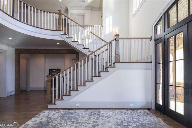 5152 Boulder Bluff Way, Suwanee, GA 30024 - stairs with a high ceiling, healthy amount of natural light, wood finished floors, crown molding, and french doors
