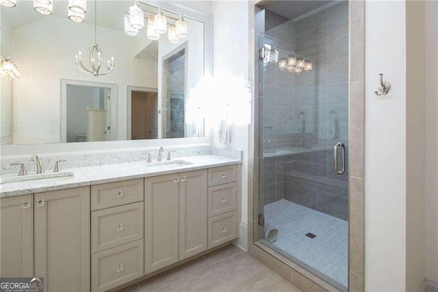 5152 Boulder Bluff Way, Suwanee, GA 30024 - bathroom featuring double vanity, a shower stall, a chandelier, and tile patterned floors