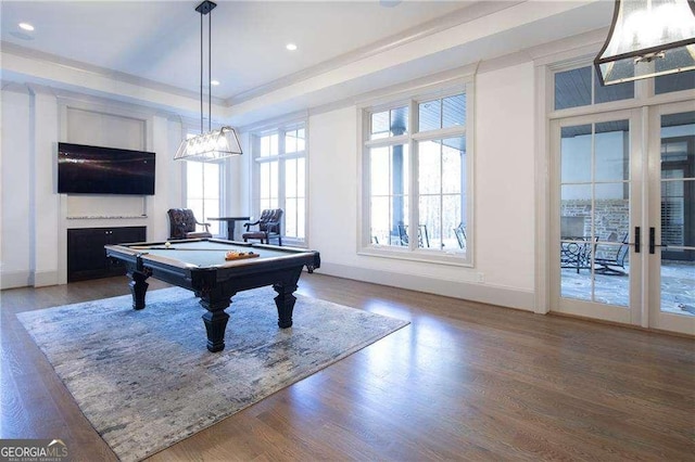 playroom featuring wood-type flooring, billiards, french doors, and a raised ceiling