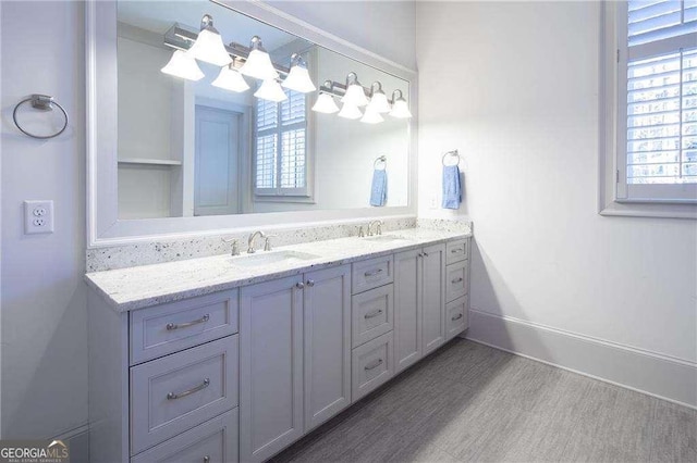 5152 Boulder Bluff Way, Suwanee, GA 30024 - full bathroom featuring double vanity, healthy amount of natural light, and wood finished floors