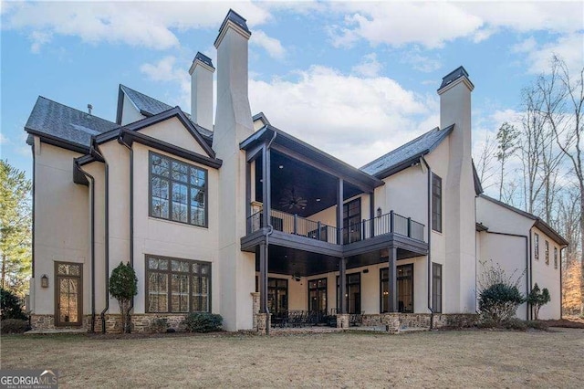 5152 Boulder Bluff Way, Suwanee, GA 30024 - back of house with a chimney, a balcony, and stucco siding