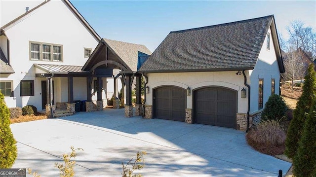 5152 Boulder Bluff Way, Suwanee, GA 30024 - view of front facade with stucco siding, an attached garage, concrete driveway, stone siding, and roof with shingles