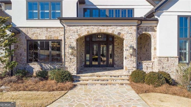 5152 Boulder Bluff Way, Suwanee, GA 30024 - doorway to property with stone siding, stucco siding, and french doors