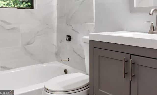 full bathroom with vanity, toilet, and washtub / shower combination