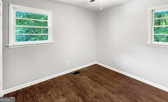 empty room featuring wood-type flooring and ceiling fan